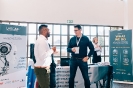 Delegates networking at the Larcai display