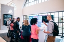 Delegates networking at the Pink Elephant display