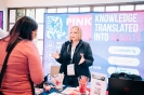 Pink Elephant stand staff networking with delegates