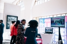Delegates networking at the Pink Elephant display