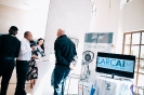 Delegates networking at the Larcai display
