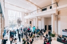 Delegates networking at the triple volume foyer