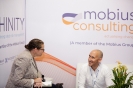 Delegates networking at the Mobius Consulting stand