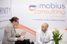 Delegates networking at the Mobius Consulting stand