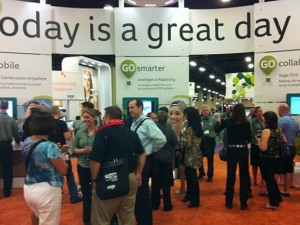 Sage Summit attendees congregating around the Sage Intelligence booth.