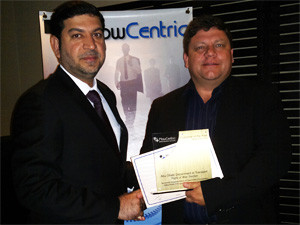 Waleed Abdulla  Al Hayyas accepting FlowCentric Middle East Customer of the Year 2012  award from Jacques Wessels.
