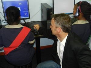 Dell's Chris Buchanan with a Christel House learner.