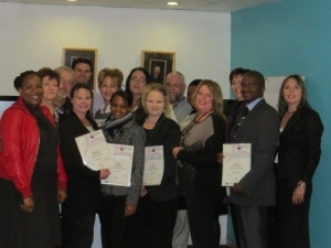 Bytes People Solutions employees awarded certificates at ceremony.