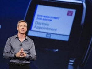 Paul Jacobs, chairman and CEO of Qualcomm, talks about the new ''Toq'' smart watch. [Photograph by Reuters]