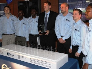SANSA Engineers involved in the SuperDARN project with a model of the Radar located in Antarctica.