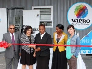 Left to right: Mr VK Sharma, High Commissioner of India,  Shilpa Yohannan from Wipro, Mrs Manyathi,  Principal of Gobandlovu Primary School, Nokulunga Lungi, Jade Orgill from Breadline.