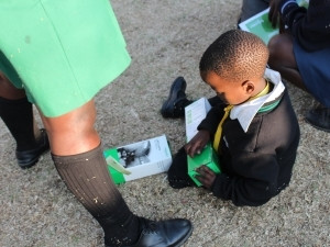 Alex families receive Schneider Electric solar lamps.