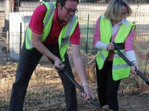 Vumatel CEO Niel Schoeman and Parkhurst Residents and Business Owners Association chairperson Cheryl Labuschagne opening the first trench for the Parkhurst fibre project in August.