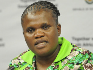 DOC minister Faith Muthambi helps to deliver essential resources for learners in Vuwani, Limpopo.