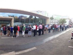 Shoppers were still joining the lengthy queue outside the iStore's Sandton outlet at 9am today.