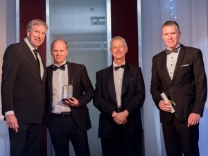 Derek Watts (the MC), with Simon Slater the COO from e4, Dave Loxton (ENSafrica, one of the judges that presented the award) & Ryan Barlow the CTO from e4, having received their SACA award.