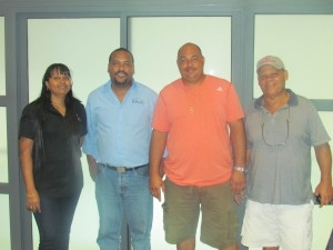 Shadon Samuels (second from left), Project Manager from Arch Retail Systems, seen at store opening with senior Rosebelle personnel: Rosie Damou, Executive Officer; Jean Pierre Morin, General Executive; and Morin Snr, General Executive