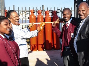 Naledi Pandor, Minister of Science and Technology, prepares to cut the ribbon to the hydrogen fuel cells providing standby power to Arthur Mfebe Senior Secondary School in Cofimvaba, Eastern Cape