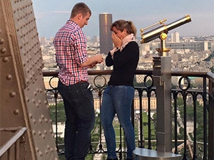 A proposal atop the Eiffel Tower was caught on camera, but the couple disappeared before the photographer could get to them.