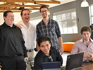 The winning GradHAck team, left to right: Wald Bezuidenhout (back), Kyle Welsh (back), Michael Brooke (back), Waseem Nabi (front), and Ross Guy (front). (Photo by Therese van Wyk)