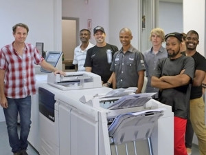 From left to right - Peter Duckitt owner of CDR Repro with his staff and the Xerox J75.