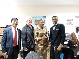 Dr Jeff Govender (FamHealth), professor Darelle van Greunen (NMMU-CCT), deputy telecoms and postal services minister Hlengiwe Mkhize, and Timothy Cuyler, a trainee from the computer centre.
