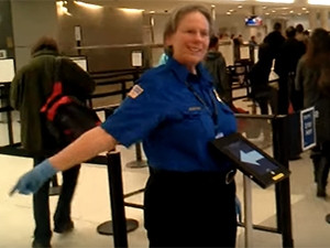 A screenshot from a YouTube video shows the TSA's "randomiser" app in practice.