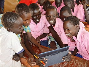 Students in Kakuma refugee camp in Kenya using tablets from Instant Classroom. (Photo by David Muya, UNHCR)