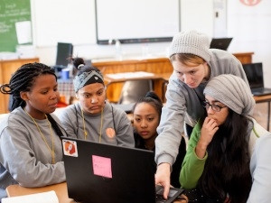 Crezell Nortje, a web development student at City Varsity, and Fahmiyah Walters, a computer science student at UWC, help learners to develop their Web site during Code4CT's two-week holiday programme.