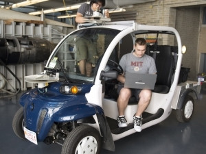 Students at MIT will be able to hail the small, golf-cart-looking vehicles from a smartphone app next month.