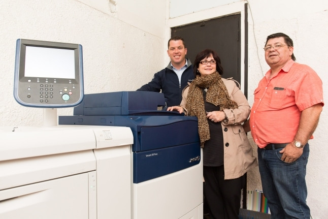 Bryn Whithair of Cape Office Machines (left) with The Print Place's Annemarie Volschenk and Joppie Volschenk.