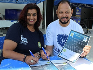 Brooklyn SAPS brigadier Kushie Nair and Namola's chief ambassador Yusuf Abramjee sign a partnership agreement committing to ensure citizen safety.