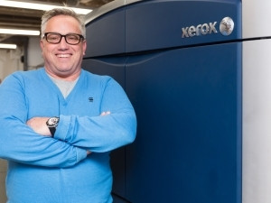 Richard Jermyn director of Creative Brands standing beside the Xerox X1000 press.