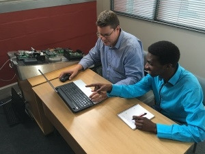 Powell Tronics' Andre Joubert trains Siyabonga Mbeleka on the ATOM suite of products.