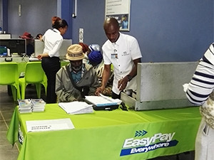 A social grant recipient registers for the EasyPay green card at a Net1 office in Bizana.