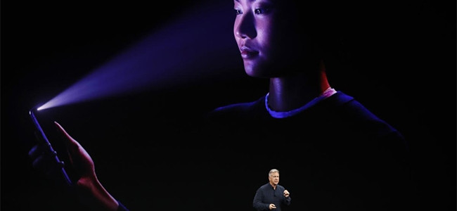 Apple senior VP of worldwide marketing Phil Schiller demonstrates FaceID on the iPhone X.