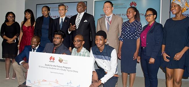 Minister Siyabonga Cwele flanked by China's ambassador to SA and this year's Seeds for the Future students.