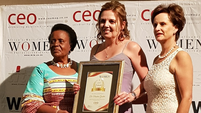 Dr Madelise Grobler [centre] receives her award from Mabel Kiggundu, founder and managing consultant of Empowad, and Annelize Wepener, CEO of CEO Global.