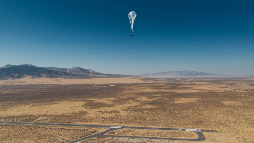 A Project Loon balloon flying high.