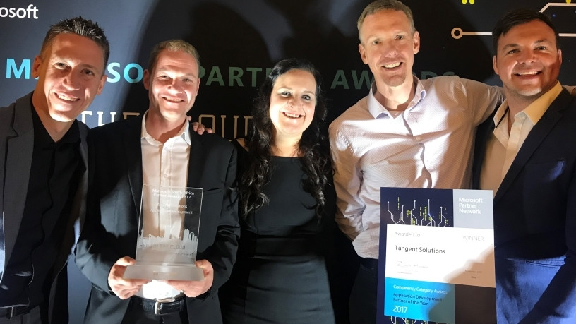 Dave Nel, Andre du Toit, Natalie Brunsdon, Cliff de Wit and Ruaan Erasmus from Tangent Solutions receive the Application Development Partner of the Year award, during the Microsoft 2017 Partner Awards held at Sandton Convention Centre.