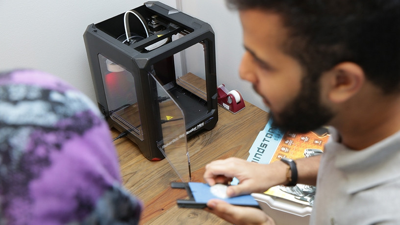Students at the UCT Innovation Lab testing the Makerbot replicator mini compact 3d printer (Photo by Michael Hammond)