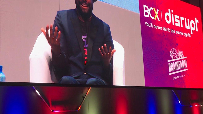 Will.i.am onstage at the BCX Disrupt Summit.