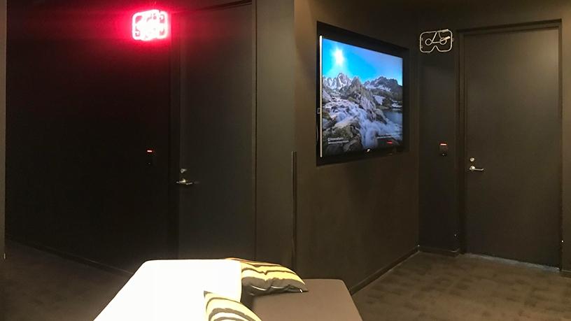 A series of audio visual rooms set up for viewing media in virtual reality.