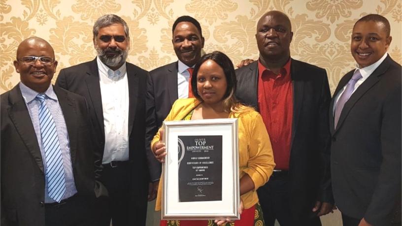 From L-R: Moses Segaetsho -  CIO at Auditor General SA, Ahmed Mahomed - Datacentrix CEO, Kenny Nkosi -  Divisional MD Public Sector at Datacentrix, Dr. Stanley Mpofu - WITS CIO, Tumi Pooe - Datacentrix Public Sector Business Unit Manager, and Mrs. Ntombi Mpofu - wife of WITS CIO (holding award).