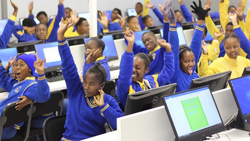 Diepsloot Combined School students sitting in the new computer lab.