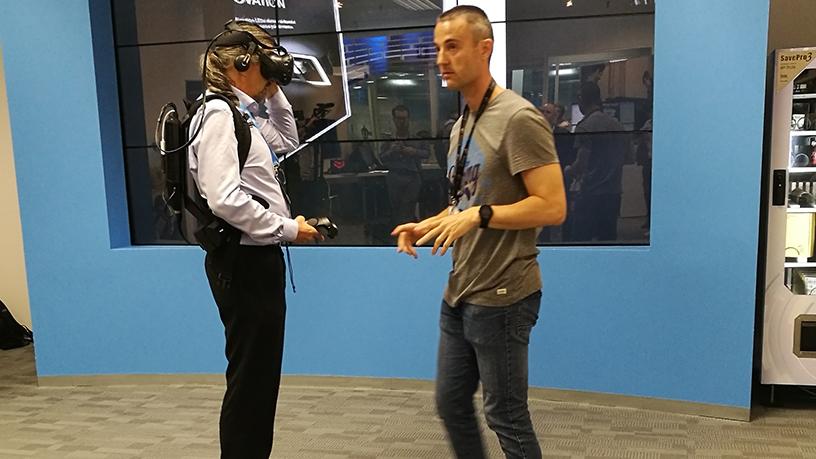 A journalist tries out HP's wearable VR backpack at the Innovation Summit in Barcelona.