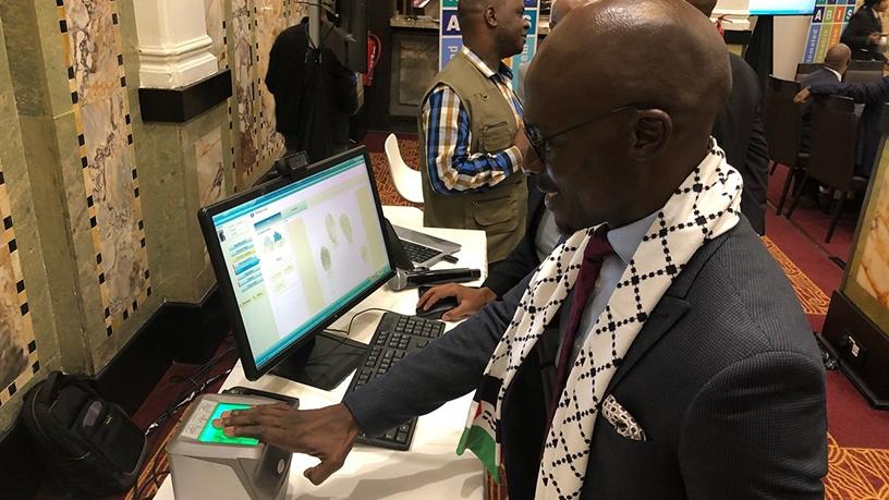 Minister Malusi Gigaba tries out the identification system at the launch event yesterday. (Photo source: SA Government News)