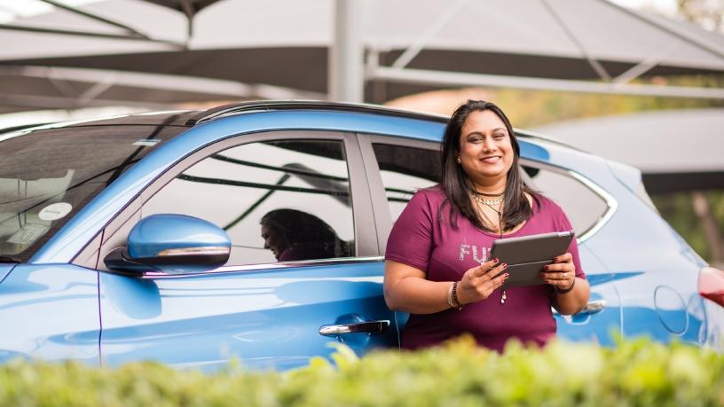 Faizah Mahomed, Finance Manager at AutoTrader, works on her mobile ERP system, Sage Business Cloud Enterprise Management.