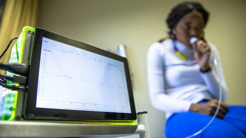 PhD candidate researcher Valentine Saasa demonstrating how to use the nanotechnology breathalyser prototype developed at the CSIR.