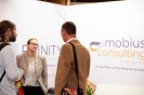 Delegates networking at the Mobius Consulting stand